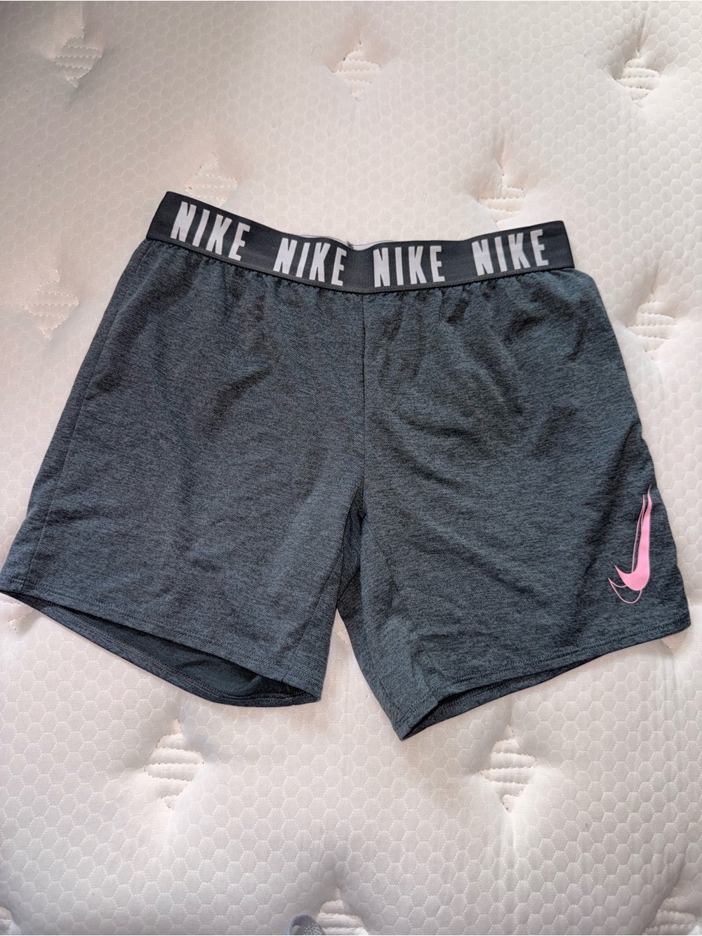 30. Nike Women's Dark Gray Athletic Shorts with Pink Swoosh